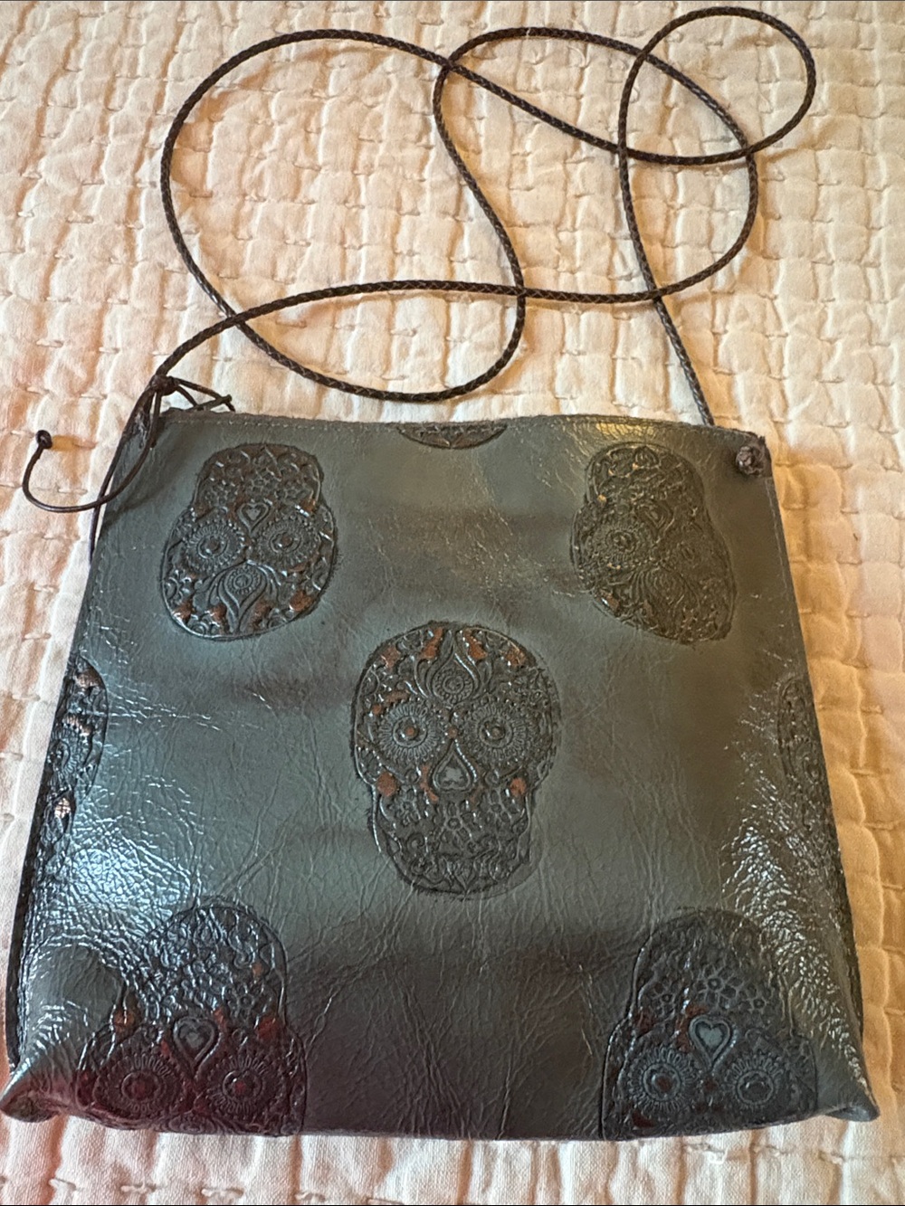 B. May Embossed Skull Crossbody bag